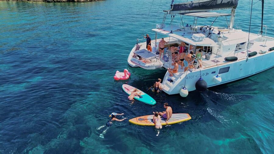 Chania Old Port: All-inclusive Catamaran Trip Agioi Theodori - Starting at Chania’s Old Venetian Port: welcome drinks and a simple rhythm