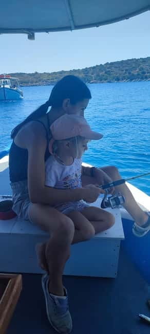 Crete: Boat Cruise with Fishing, Swimming, Lunch, and Drinks - Lunch on board: the catch of the day, Greek salad, and unlimited drinks