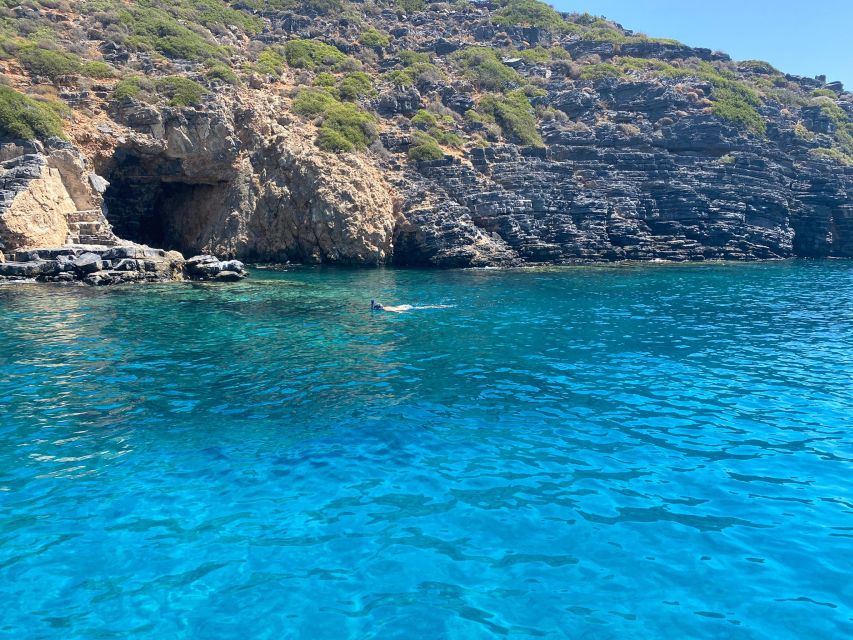 Crete: Fishing & Swimming Boat Cruise with Lunch & Drinks - Swimming and snorkeling in Elounda Bay, plus sea cave time