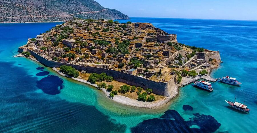 Crete: Spinalonga, Elounda, & Agios Nikolaos Boat Tour & BBQ - Elounda and Mirabello Bay: the scenic “breather” before Spinalonga