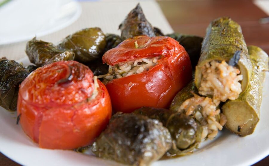Dining In Rethymno: An Evening Of Cretan Cooking - The food table: wine, raki, tzatziki, and plenty of plates
