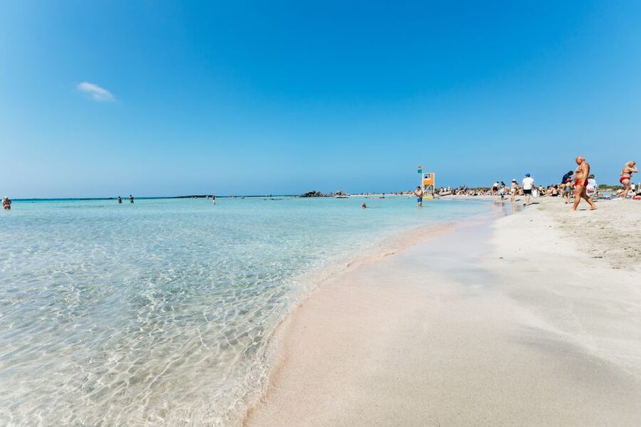 From Chania: Day Trip to Elafonisi Island Pink Sand Beach - Getting to Elafonisi Island: walking in shallow water