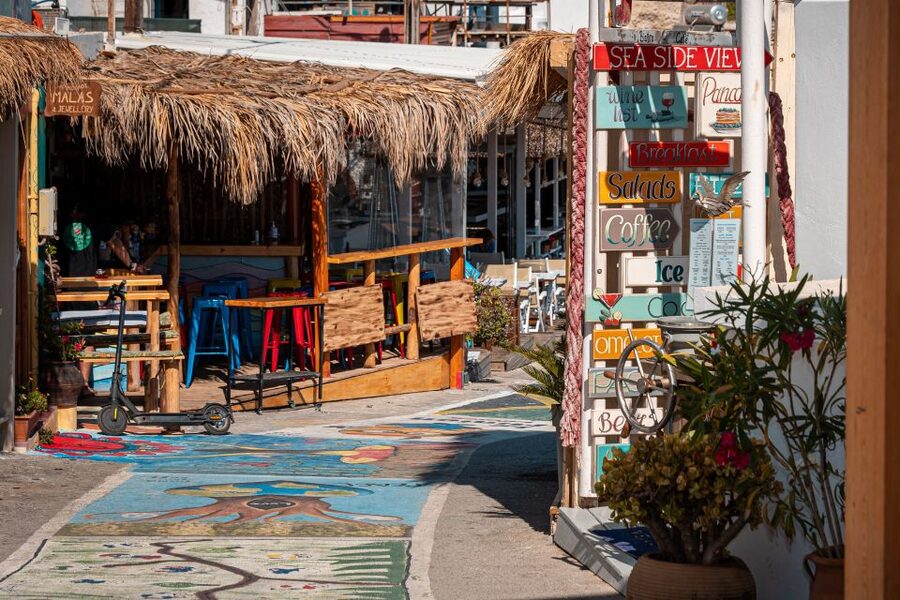 From Heraklion: Day Trip to Matala Hippie Beach and Caves - Wandering the colorful town and eating lunch by the water