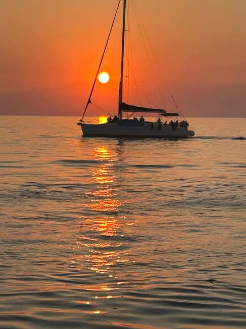 Heraklion: Dia Island Sunset Boat Tour with Dinner - Saint George Bay at Dia Island: swimming, snorkeling, fishing, and SUP