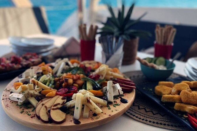 Panormo: Luxury Sunset Catamaran Cruise Sushi & Open Bar - Boarding at Panormo Port, with DanEri Yachts and a small-group setup
