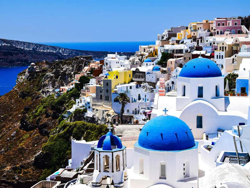 Santorini Guided Day Trip From Crete with Ferry Tickets - Oia: blue domes, cliffside lanes, and a fast photo strategy
