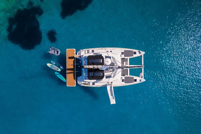 Semi-private Sailing trip with Lunch and Water Toys - The water toy lineup: slide days, sea scooters, and a transparent canoe